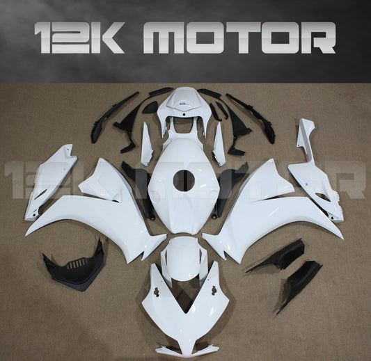 Aftermarket plain white fairing kit for HONDA CBR1000RR laid out on a flat surface, including various panels and parts.