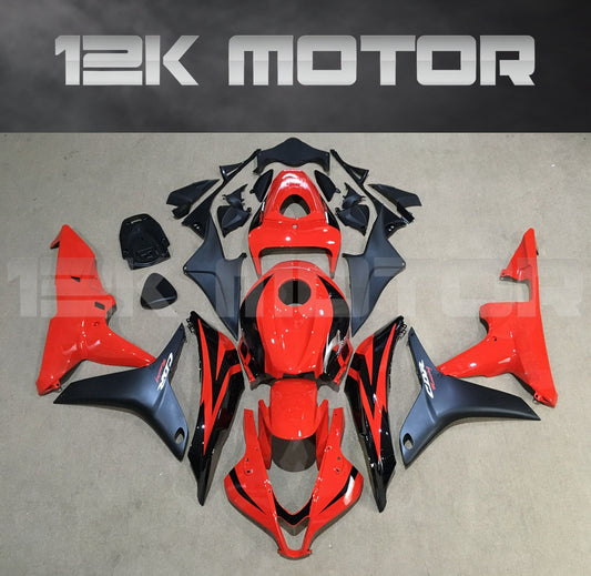 Red and black fairing kit for HONDA CBR600RR, displayed on a table with the brand name 12K MOTOR visible.