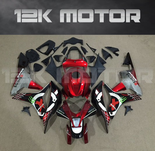 Aftermarket red fairing kit for HONDA CBR600RR motorcycle displayed on a table, including various panels and parts.
