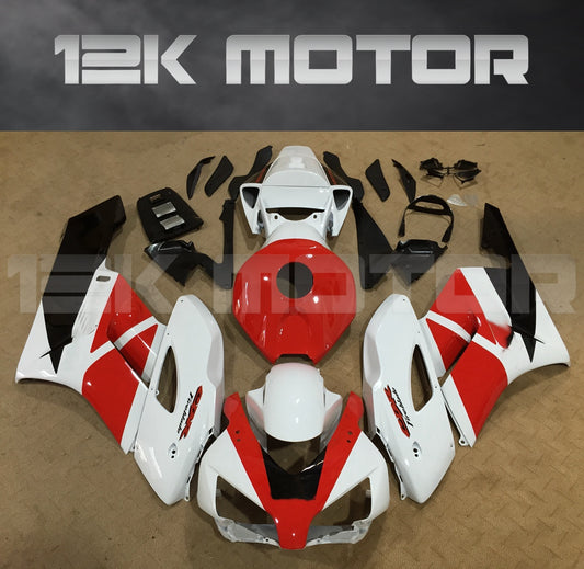 Aftermarket fairing kit for HONDA CBR1000RR motorcycle, featuring a red and white color scheme with black accents, laid out on a flat surface.