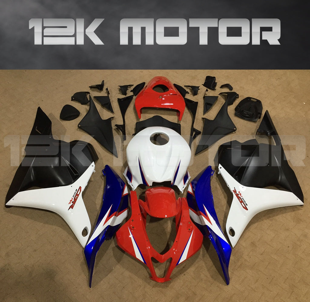 Aftermarket fairing kit for HONDA CBR600RR 2009-2012 displayed on a table, featuring a mix of red, white, blue, and black panels.