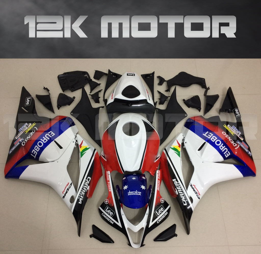 Aftermarket fairing kit for HONDA CBR600RR 2009-2012 displayed on a table, consisting of various pieces in red, white, blue, and black colors.