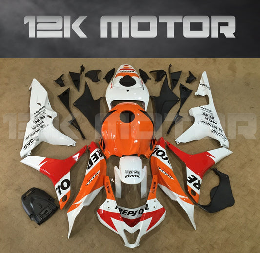 Aftermarket Repsol fairing kit for Honda CBR600RR motorcycle, featuring a white, red, and orange color scheme with sponsor logos.