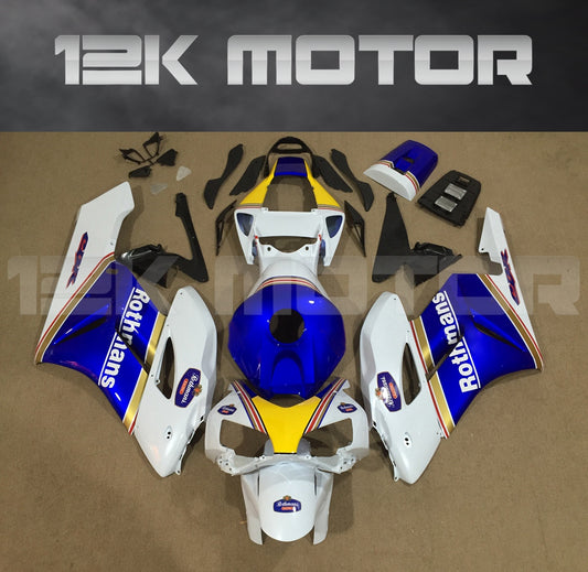 Aftermarket fairing kit for HONDA CBR1000RR motorcycle, featuring a white, blue, and yellow color scheme with Rothmans branding, displayed on a table.
