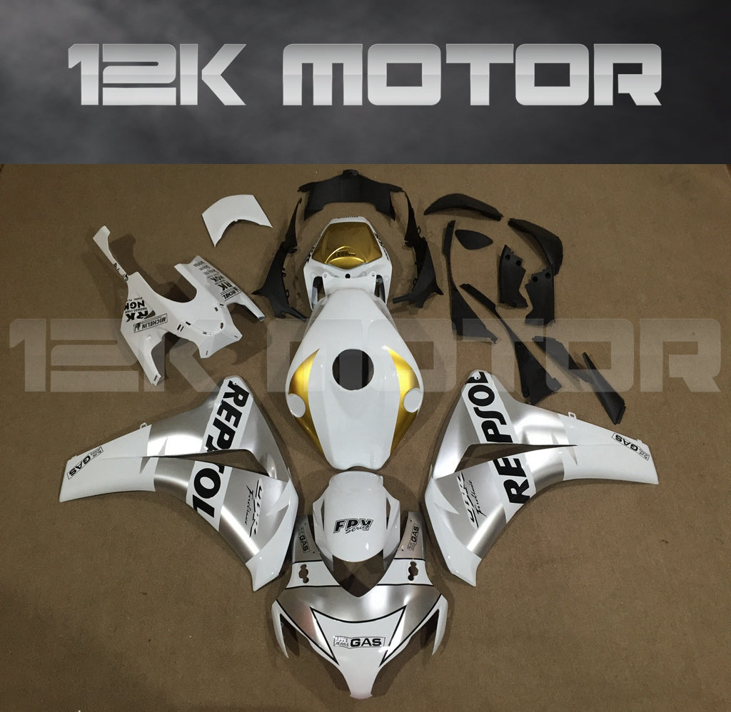 Aftermarket fairing kit for HONDA CBR1000RR motorcycle, featuring a silver and white color scheme with Repsol branding, displayed on a table.