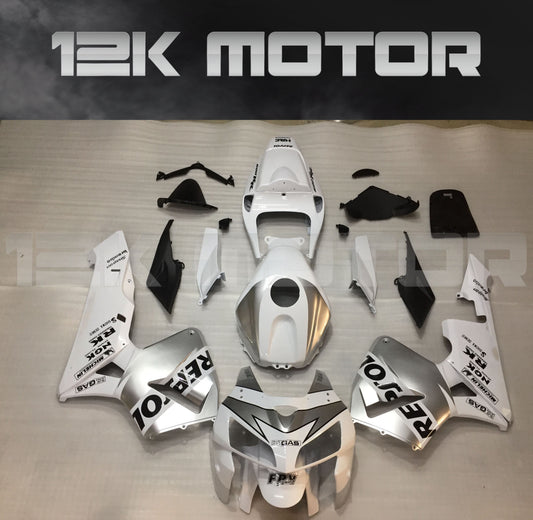 Aftermarket silver and white fairing kit for HONDA CBR600RR 2005 2006 displayed on a table.