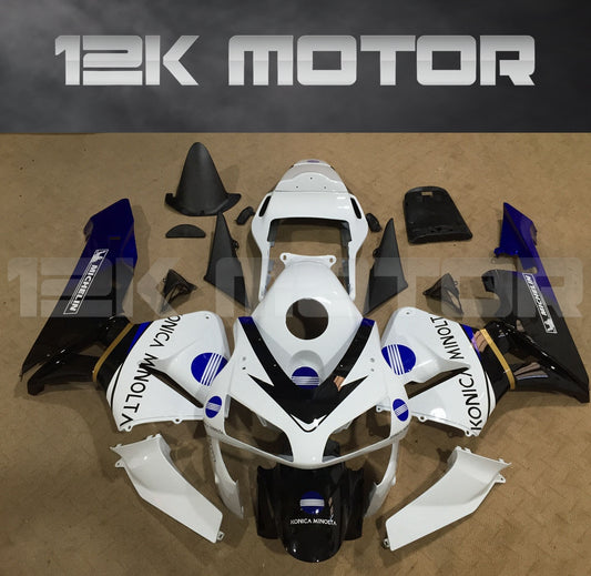 Aftermarket fairing kit for HONDA CBR600RR, displayed as a set of various pieces in white, black, and blue colors on a table.