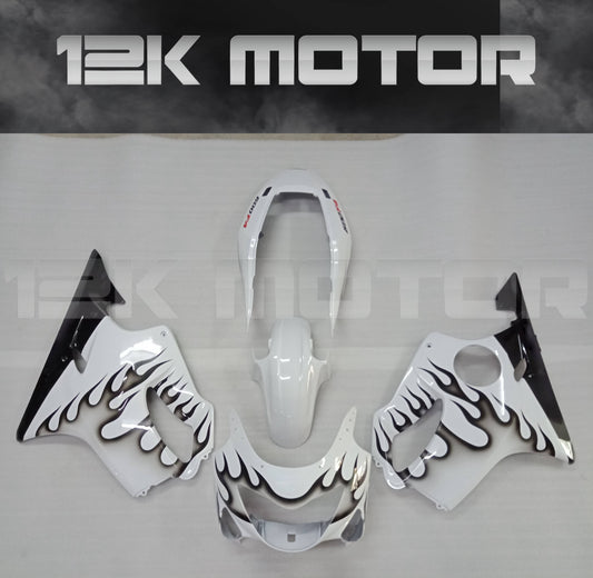 Aftermarket fairing kit for HONDA CBR600RR F4 1999 2000 displayed on a table, featuring a white color with black flame designs.