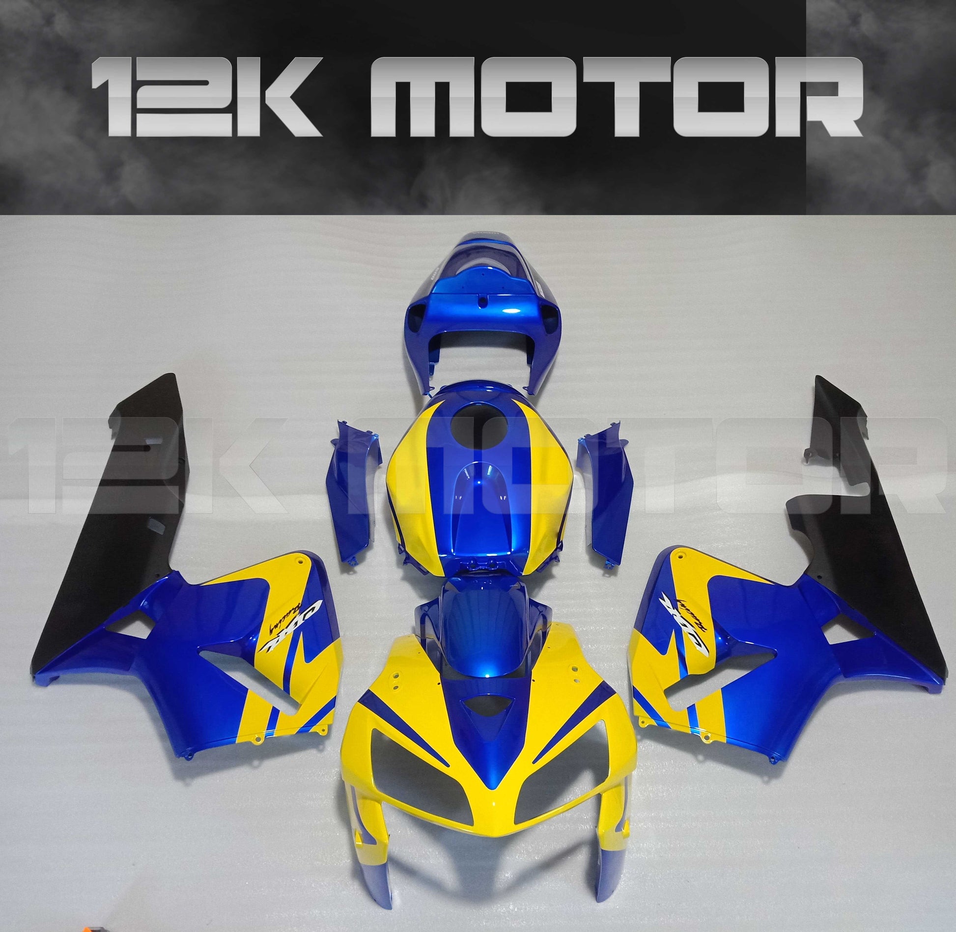 Aftermarket fairing kit for HONDA CBR600RR motorcycle, featuring yellow and blue panels with black accents, displayed on a flat surface.