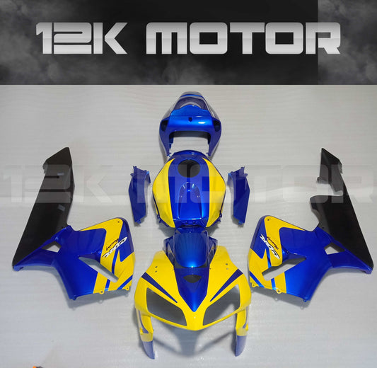 Aftermarket fairing kit for HONDA CBR600RR motorcycle, featuring yellow and blue panels with black accents, displayed on a flat surface.